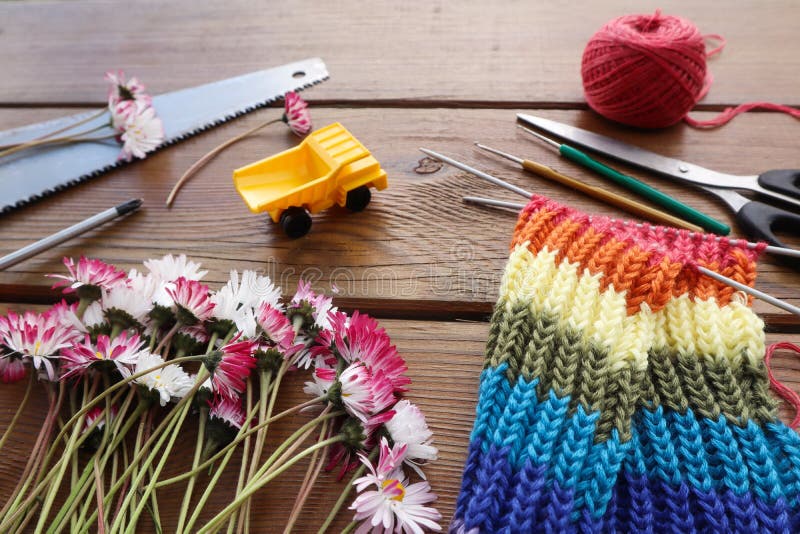 A joyous pastime in the country or in a country house. Knitting and construction, outdoor games. Side view, close-up stock photography A joyous pastime in the country or in a country house. Knitting and construction, outdoor games. Side view, close-up stock photography