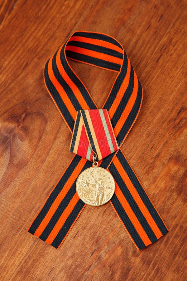 Jubilee medal Thirty Years of Victory in the Great Patriotic War of 1941-1945 and George's Ribbon royalty free stock images Jubilee medal Thirty Years of Victory in the Great Patriotic War of 1941-1945 and George's Ribbon royalty free stock images