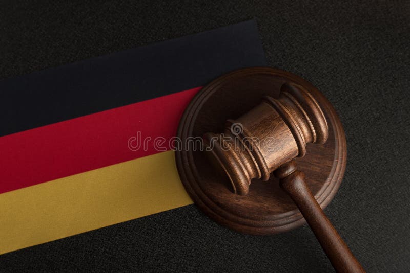 Judge Gavel on Background of the Flag Germany. Law and Justice Stock