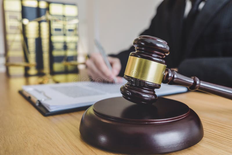 Judge gavel with scales of justice, professional male lawyers or counselor working having at law firm in office. Concepts of law stock photos Judge gavel with scales of justice, professional male lawyers or counselor working having at law firm in office. Concepts of law stock photos