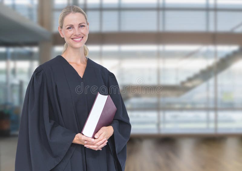 Judge holding book in front of windows royalty free stock photo Judge holding book in front of windows royalty free stock photo