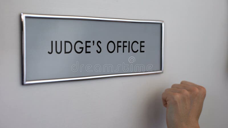 Judge office door, lawyer hand knocking closeup, court hearing, justice system royalty free stock photography Judge office door, lawyer hand knocking closeup, court hearing, justice system royalty free stock photography