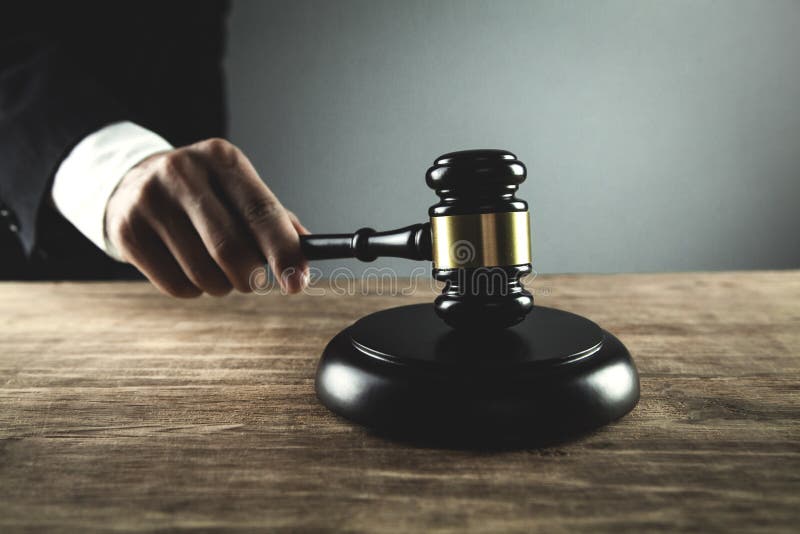 Judge striking gavel on sounding block. Law and Justice concept stock photography