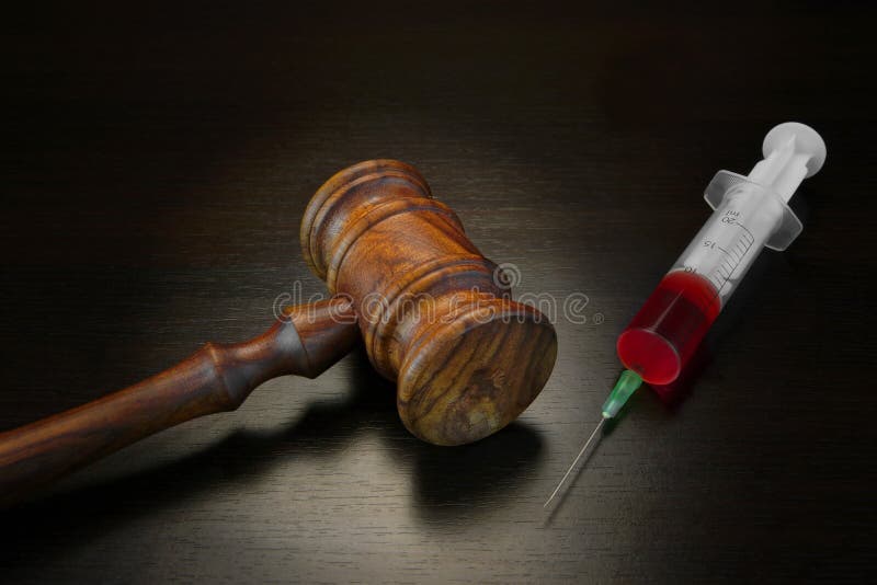 Judges Gavel And Medical Injection Syringe On Black Wooden Backg stock image Judges Gavel And Medical Injection Syringe On Black Wooden Backg stock image