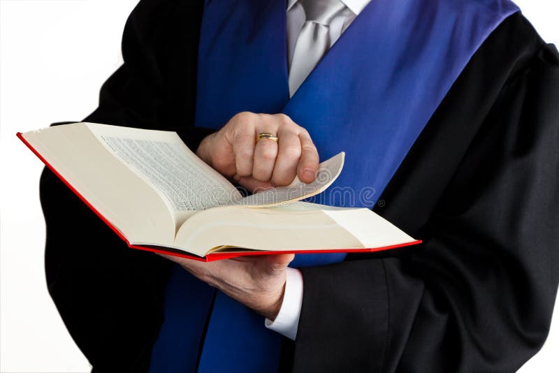 A judge with a law book in court. With Justice figure in the hand. A judge with a law book in court. With Justice figure in the hand.