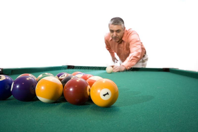 A man at the pool table ï¿½ ready to break. White background. A man at the pool table ï¿½ ready to break. White background.