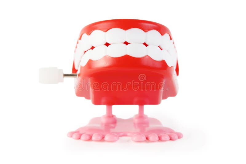 Juegue la quijada del mecanismo con los dientes blancos en las piernas rosadas