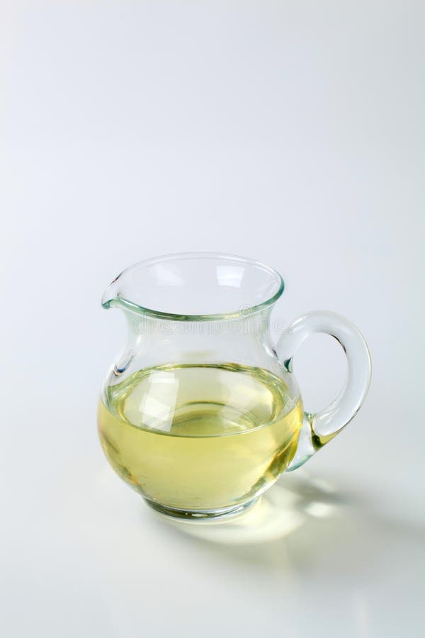 Jug of cooking oil stock photo. Image of condiment, rapeseed 60831700