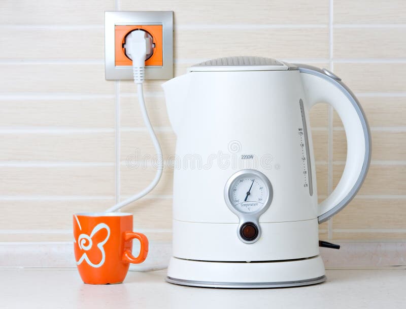 Electric Metallic Kettle with Plug in Socket Stock Photo - Image of  electrical, domestic: 218681954