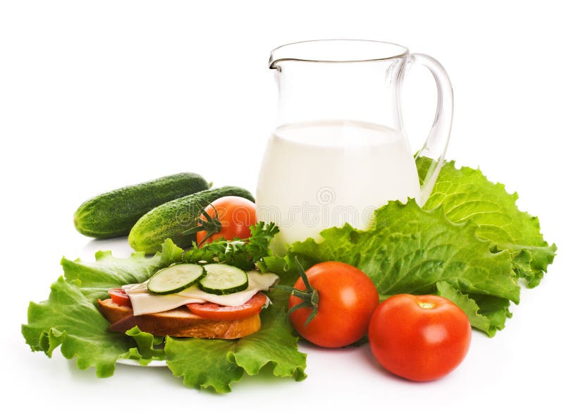 Jug of milk and fresh vegetables