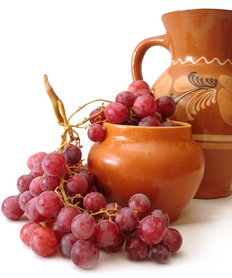 Jug and red grapes