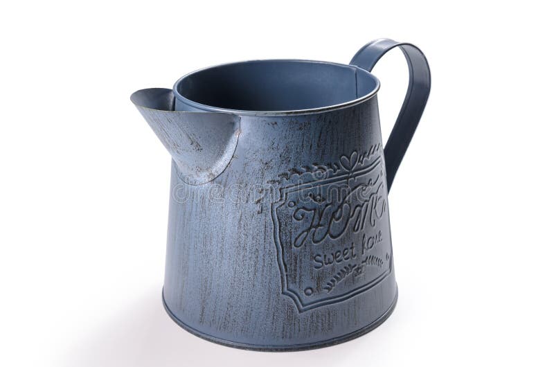 Jug for watering flowers stock image. Image of garden 220770981