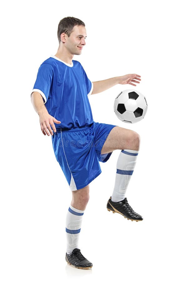 Jugador de fútbol con una bola imagen de archivo Jugador de fútbol con una bola imagen de archivo
