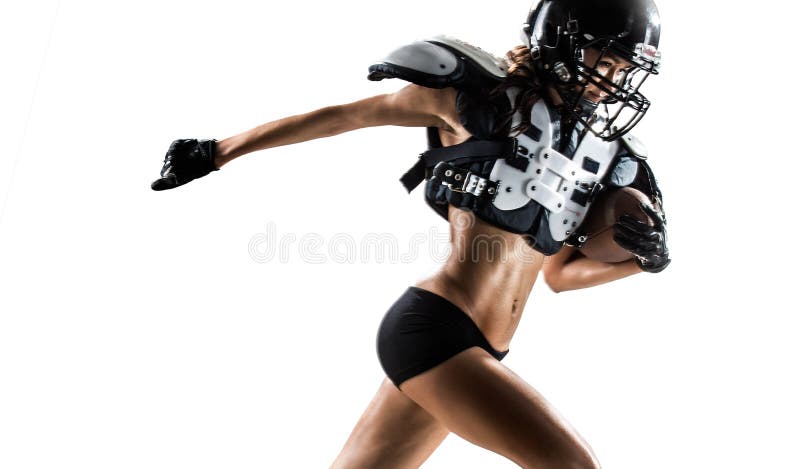 Jugador de la mujer del fútbol americano en la acción foto de archivo Jugador de la mujer del fútbol americano en la acción foto de archivo