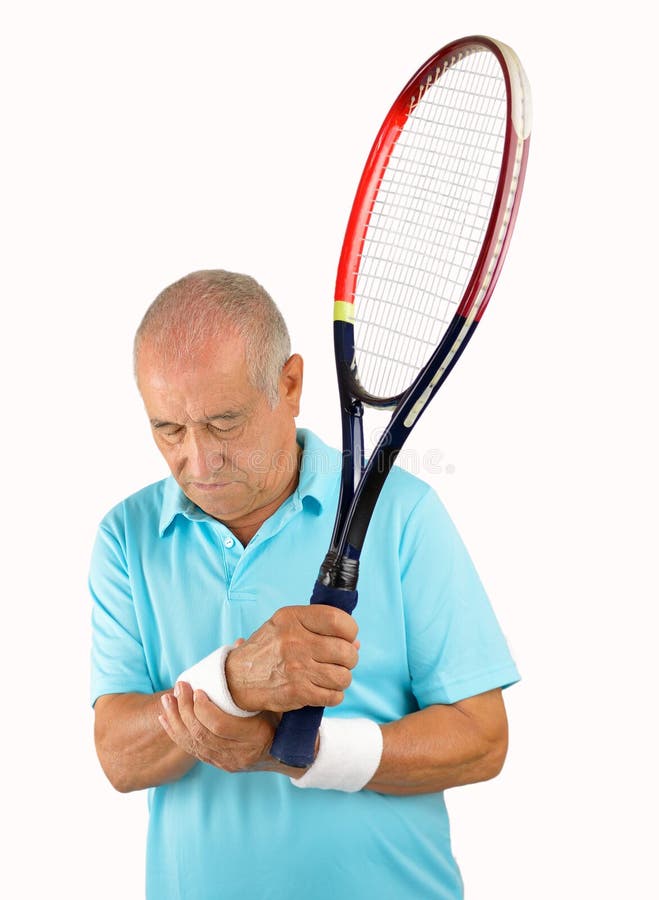 Jugador de tenis mayor con dolor de la muñeca foto de archivo Jugador de tenis mayor con dolor de la muñeca foto de archivo