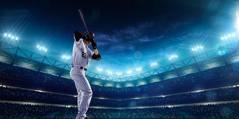 Jugadores de béisbol profesionales en arena magnífica de la noche foto de archivo libre de regalías Jugadores de béisbol profesionales en arena magnífica de la noche foto de archivo libre de regalías