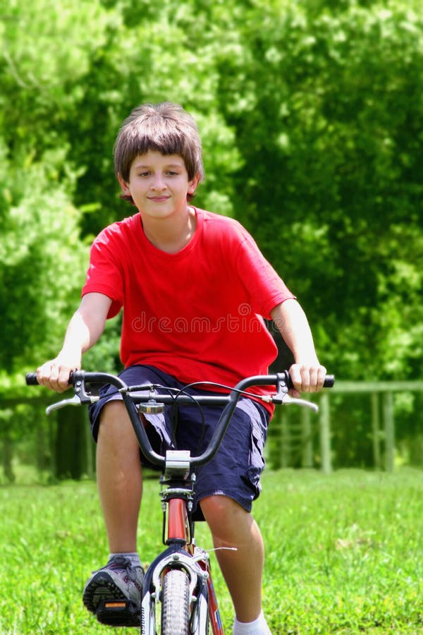 Teenager boy with bicycles in summer park. Teenager boy with bicycles in summer park