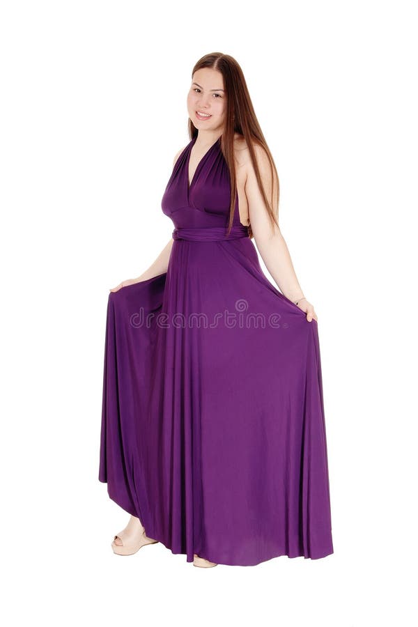 Jugendlichmädchenstellung in ihrem Burgunder-Abschlussballkleid stockbild Jugendlichmädchenstellung in ihrem Burgunder-Abschlussballkleid stockbild