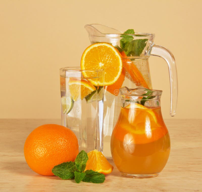 Jugs with drinks and glass