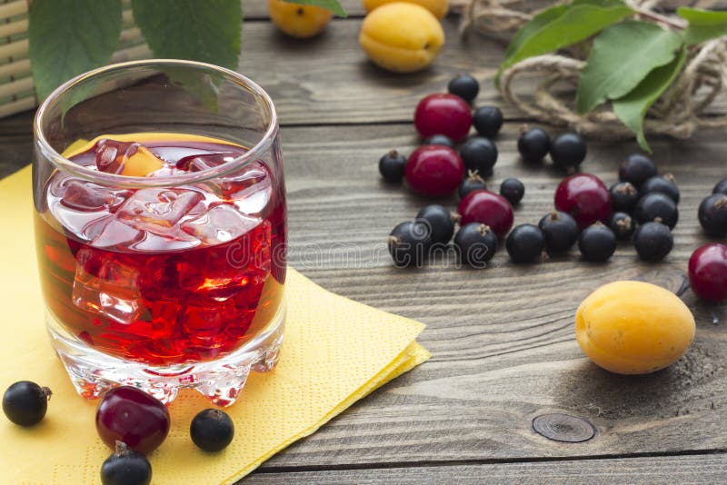 Juice and various berries on the table. Various sweet preserves stock images, royalty-free photos and pictures