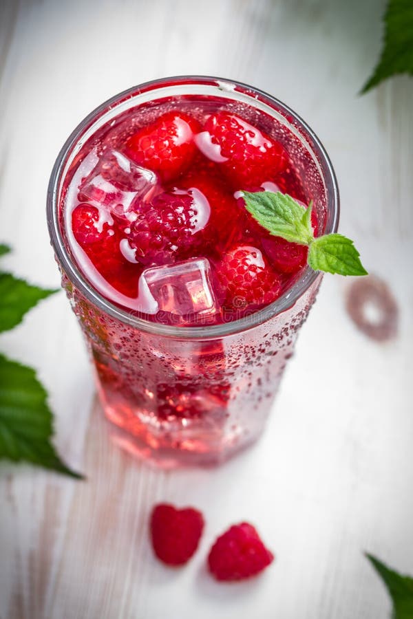 Closeup of Juice of fresh raspberries with ice. Raspberry basket stock images, royalty-free photos and pictures