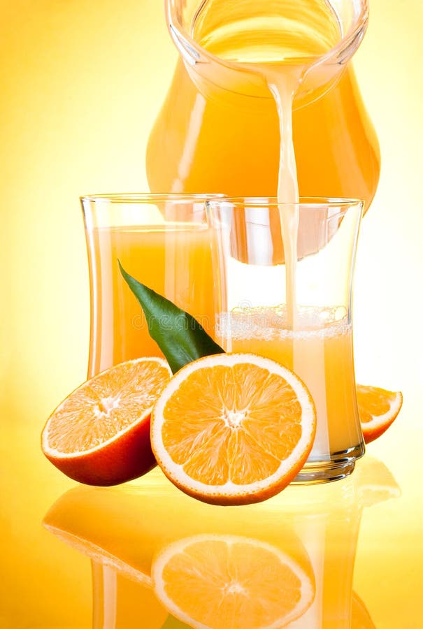 Juice Pitcher, Oranges with Leaves on Yellow Backgr Stock Photo Image