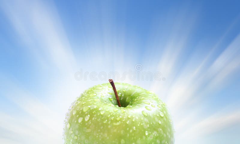 Juicy apple on blue