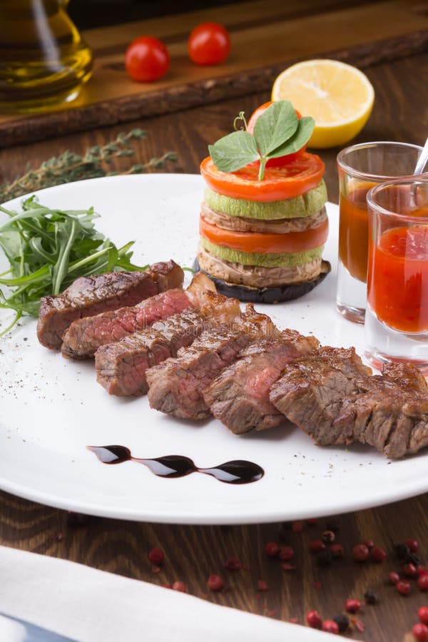Juicy Freshly Grilled Steak Served with Chili Sauce and Vegetables ...