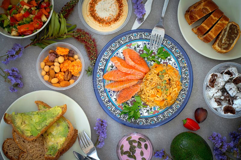 Juicy Portions of Fillet Salmon Served with Rice, Vegetable Salad