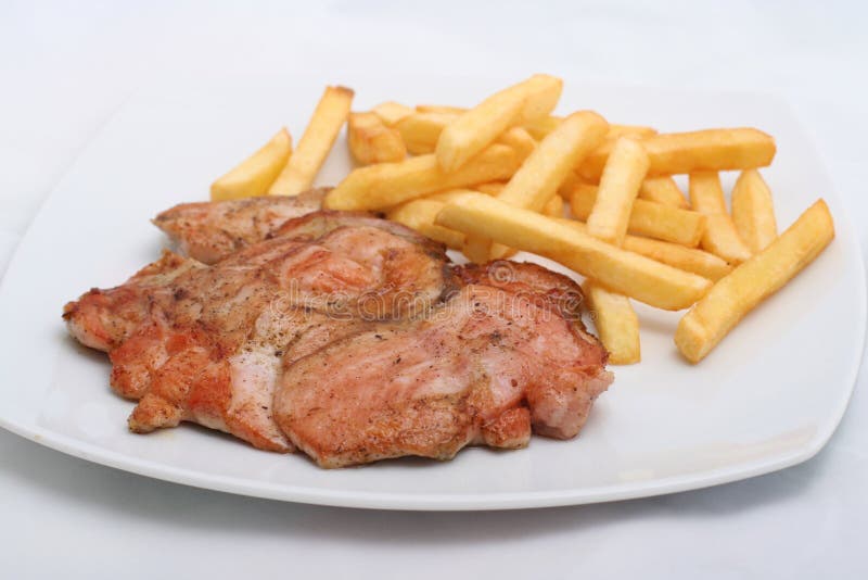 Juicy steak with french fries stock image