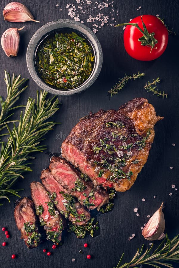 Juicy tender sous-vide grilled irish beef rump steak with fresh herbs
