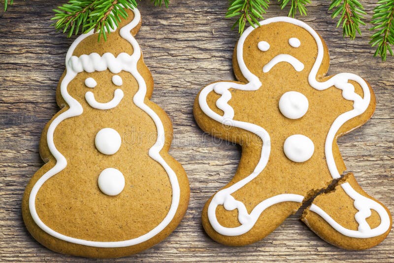 Julpepparkakan formar lyckligt och olyckligt royaltyfria bilder Julpepparkakan formar lyckligt och olyckligt royaltyfria bilder