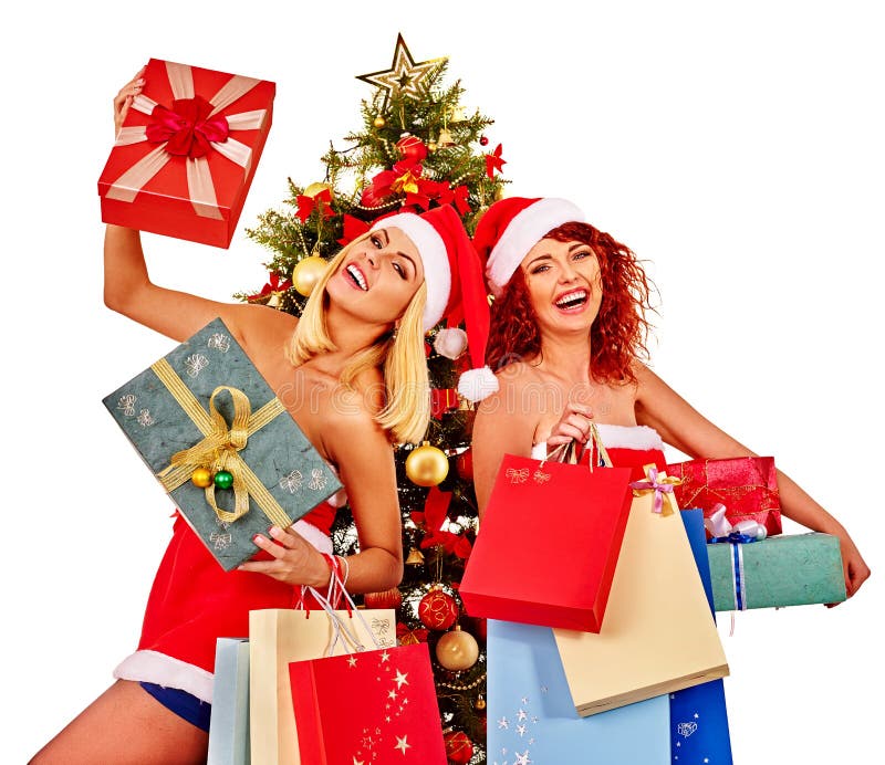 Julvänkvinnor med shoppingpåsen och gåvaasken arkivbild Julvänkvinnor med shoppingpåsen och gåvaasken arkivbild