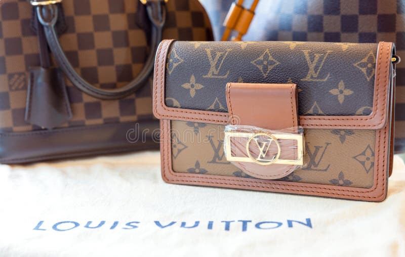 July 26, 2021: Nakhon Prathom, THAILAND, A woman carrying a Louis Vuitton  square bag. Louis Vuitton is a high-end fashion house known for its leather  goods. Stock Photo