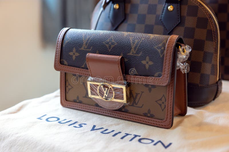 July 26, 2021: Nakhon Prathom, THAILAND, A woman carrying a Louis Vuitton  square bag. Louis Vuitton is a high-end fashion house known for its leather  goods. Stock Photo