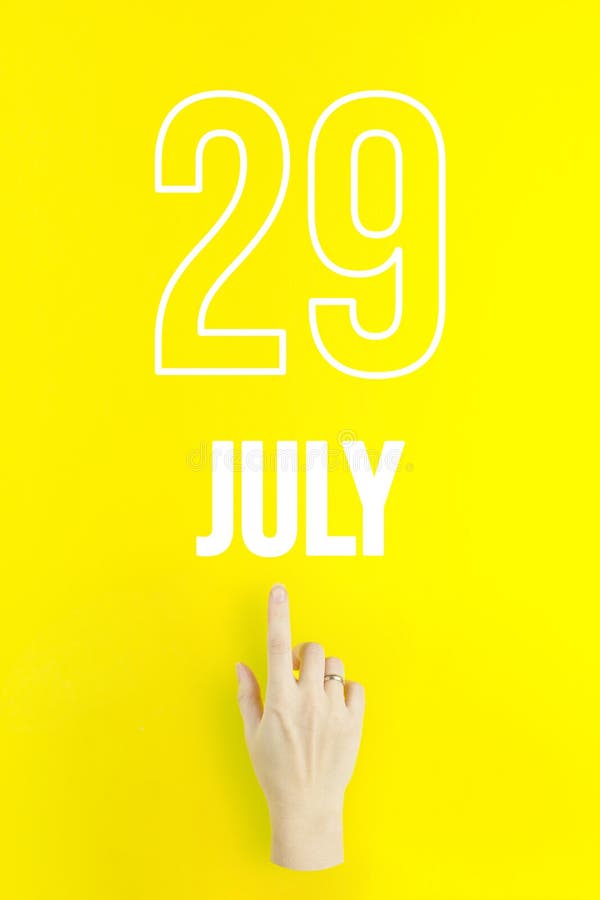 July 29th. Day 29 of Month, Calendar Date.Hand Finger Pointing at a