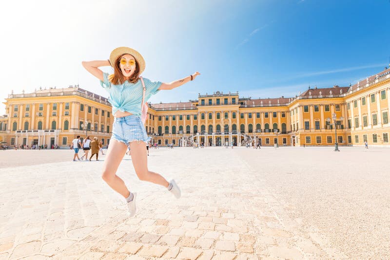 asian girl travels and having fun in schonbrunn palace complex. Gardens and courtyard are