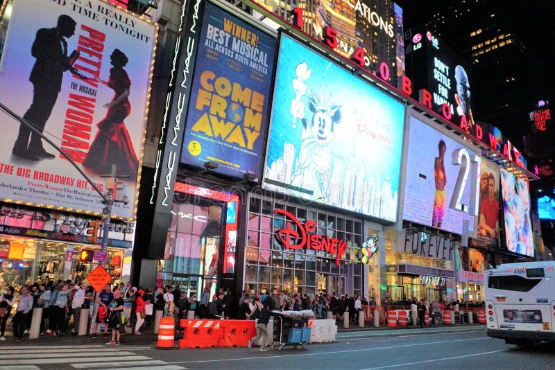 Big Apple Broadway lit up at night