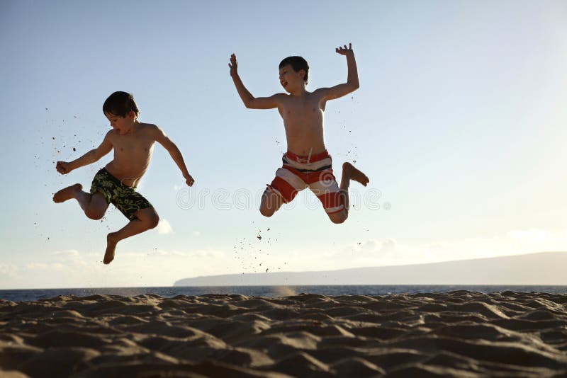 Jump at the beach stock image. Image of friends, celebration - 23539935