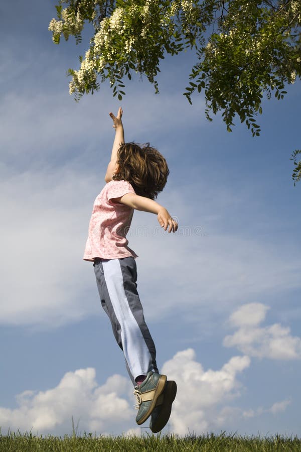 Jump of child for the flower