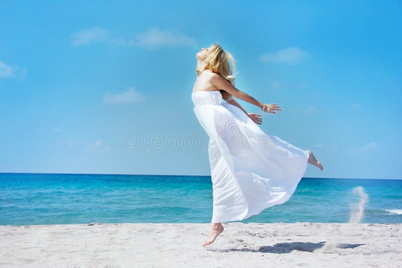 Jumping girl on sea