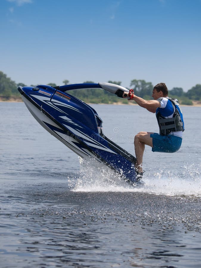 Jumping man on jet ski stock image. Image of race, intense 9961943