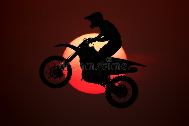 Motocross Rider Performing High Jump At Sunset Stock Photo - Download Image  Now - Motocross, Motorcycle, Jumping - iStock