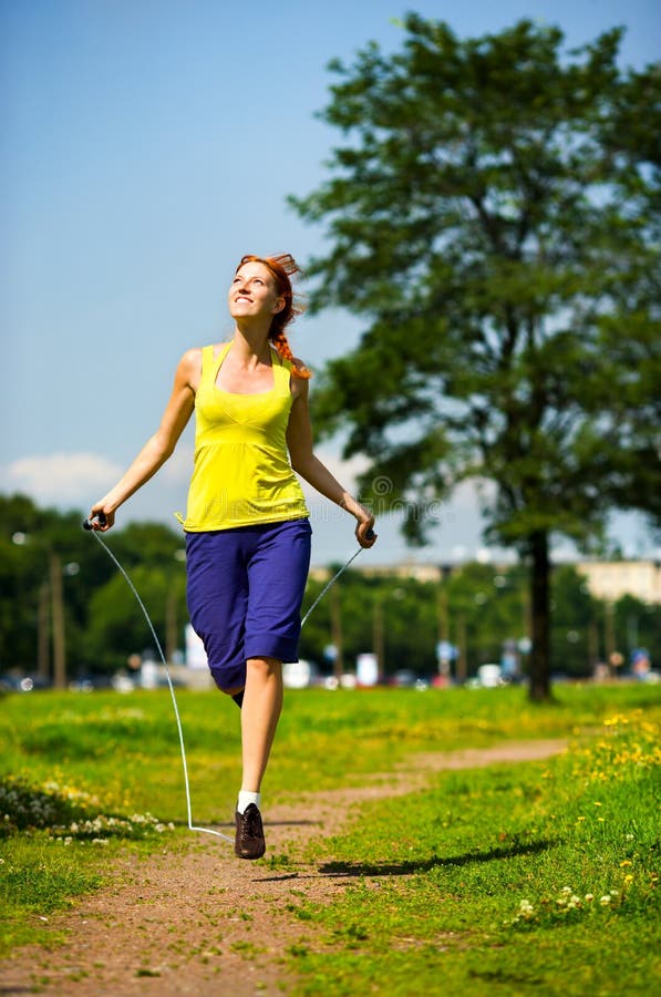 Redhead woman with skipping rope. Redhead woman with skipping rope