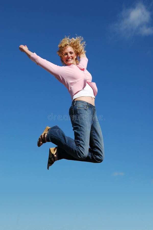 Jumping woman on a sunny day