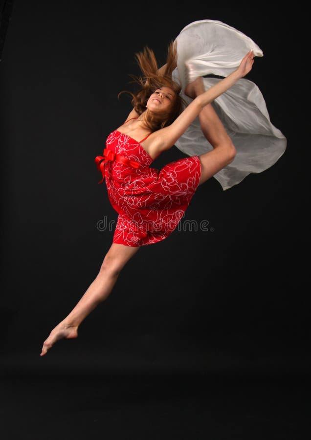 Jumping young elegant woman