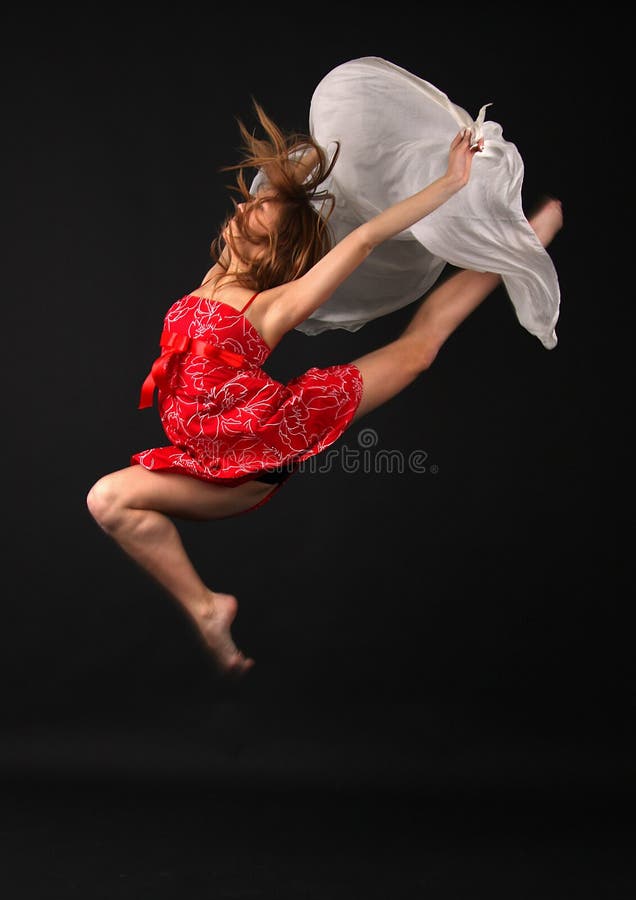 Jumping young elegant woman