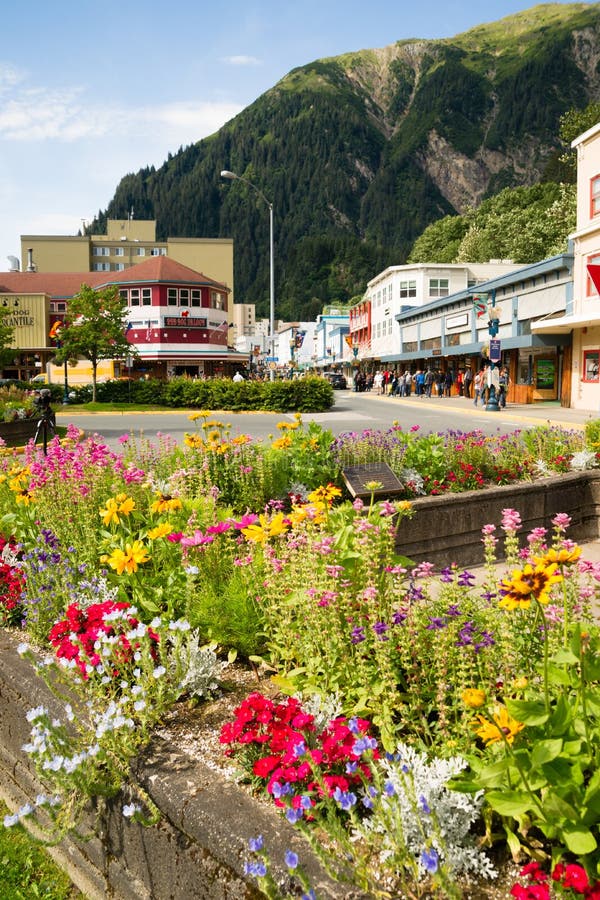 JUNEAU, ALASKA/UNITED STATES â€“ AUGUST 5: Tourists walk the street in downtwon towards the end of the summer season on