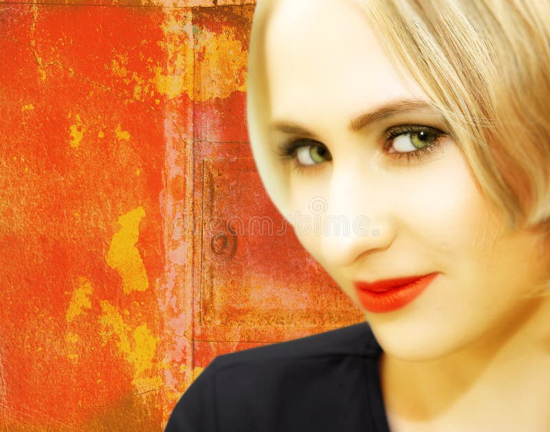 Blond woman with green eyes and red lips on textured painted red background. Blond woman with green eyes and red lips on textured painted red background