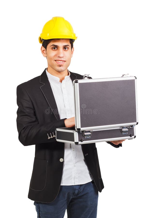 Young man in a construction helmet with the diplomat in his hands on the white background. Young man in a construction helmet with the diplomat in his hands on the white background